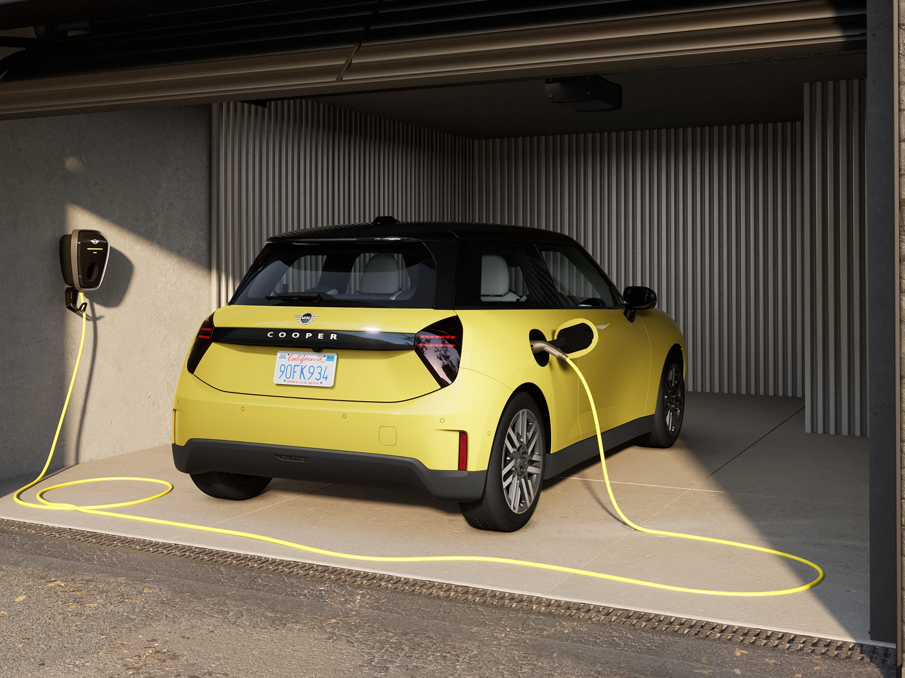 MINI Cooper Electric in Sunny Side Yellow charging in a garage.